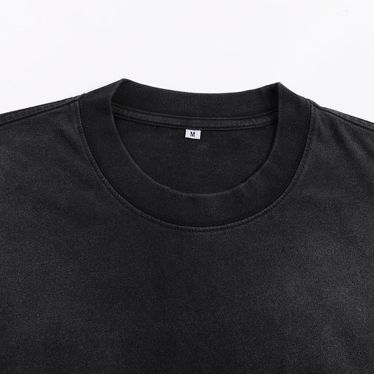 Void Eclipse sunfaded tee crew neck detail showing ribbed collar on washed black heavyweight cotton