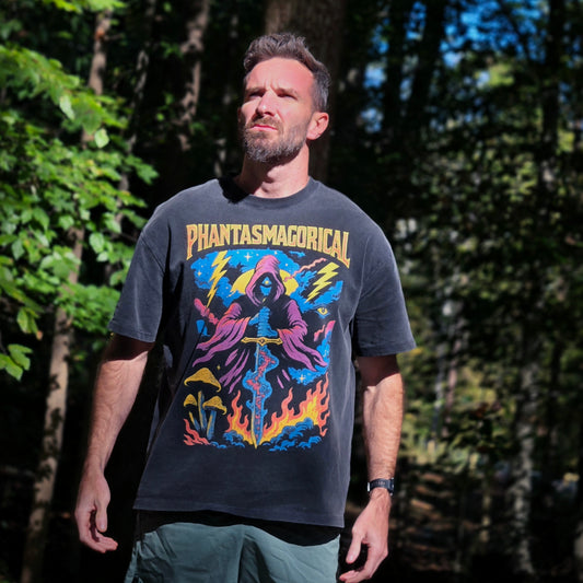 Man wearing Spectral Knight Fluffy Vintage tee outdoors in forest setting