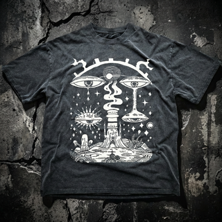Charcoal Paradoxical Perspective fluffy vintage heavyweight tee on cracked concrete, printed in white with crying surreal eyes, a tree-stump temple, sun-eye and mushrooms.