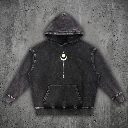 Charcoal snow wash Existential hand-frayed heavyweight hoodie on concrete, hood up with kangaroo pocket, printed with a cream crescent moon and celestial stack on the chest.