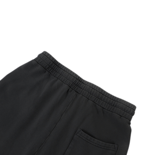 Rear elasticated waistband and patch pocket detail on black Spirit Molecule barrel leg sweatpants