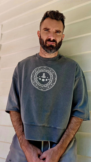 Model wearing the Paradigm mineral wash boxy raw-edge tee, showing the relaxed short-sleeve fit