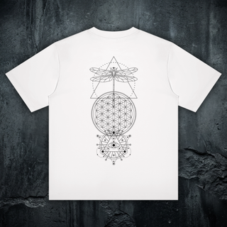 Existential celestial crewneck tee in white, styled flat lay, large black sacred-geometry back print with dragonfly, flower of life, and all-seeing eye
