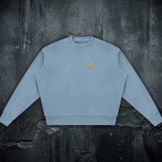 Front of the 360 GSM vintage-washed cotton crewneck sweatshirt in jeans blue, with the Phantasmagorical logo on the left chest