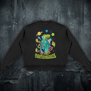 Back of the Macrodose Microcosm crewneck sweatshirt in black, printed with a teal melting face, exposed green brain, cyan comet streaks, orbiting planets and magenta mushrooms