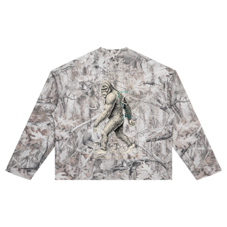 Back of the PsySquatch tree camo waffle knit long sleeve, the sasquatch resolving out of the all over snow tree camo with a Flower of Life mandala ghosted into the branches, teal mycelium on the shoulder and mushrooms at the feet