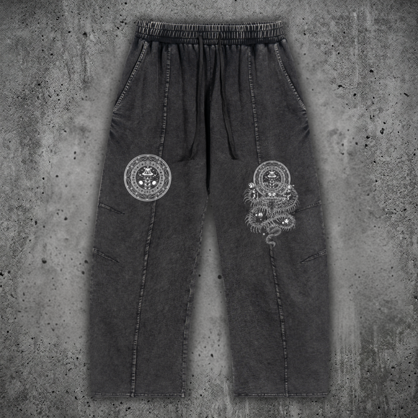 Front view of the DMT.exe snow wash heavyweight drawstring cotton pants featuring an oversized baggy fit, functional pockets, and psychedelic snake artwork on 240 GSM premium cotton.