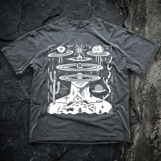Charcoal Spaced Out fluffy vintage heavyweight tee on dark slate, printed in white with a profile face crowned by orbital rings, sun, cactus and a cosmic desert scene.
