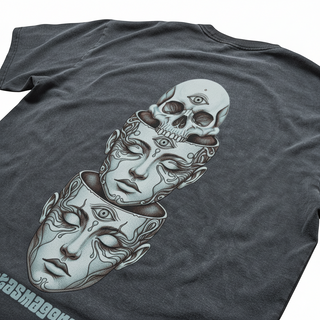 Close-up of Metamorphosis back print featuring detailed skull and layered faces illustration