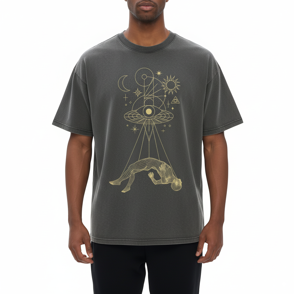 Front view of Dimensional Drift charcoal tee with gold celestial figure and eye graphic