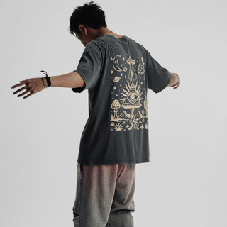 Model wearing Mystic Signal Fluffy Vintage tee showing back graphic with UFO and mystic desert scene oversized fit