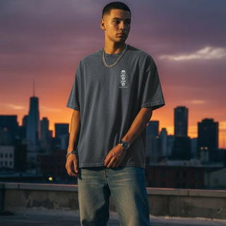 Model wearing Metamorphosis tee at sunset rooftop with city skyline background