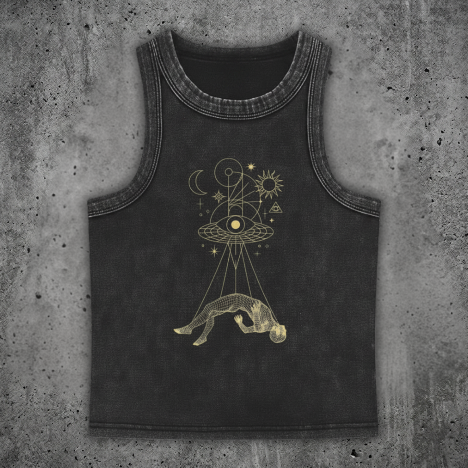 Black tank top with gold astrological design on a concrete surface