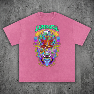 Pink t-shirt with a colorful graphic design on a gray concrete background