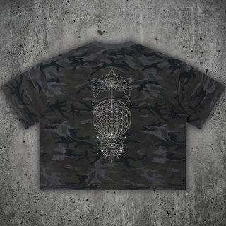 Dark green camo Existential boxy t-shirt, back view on concrete, printed with white line art of a dragonfly, Flower of Life and an all-seeing eye in sacred geometry.