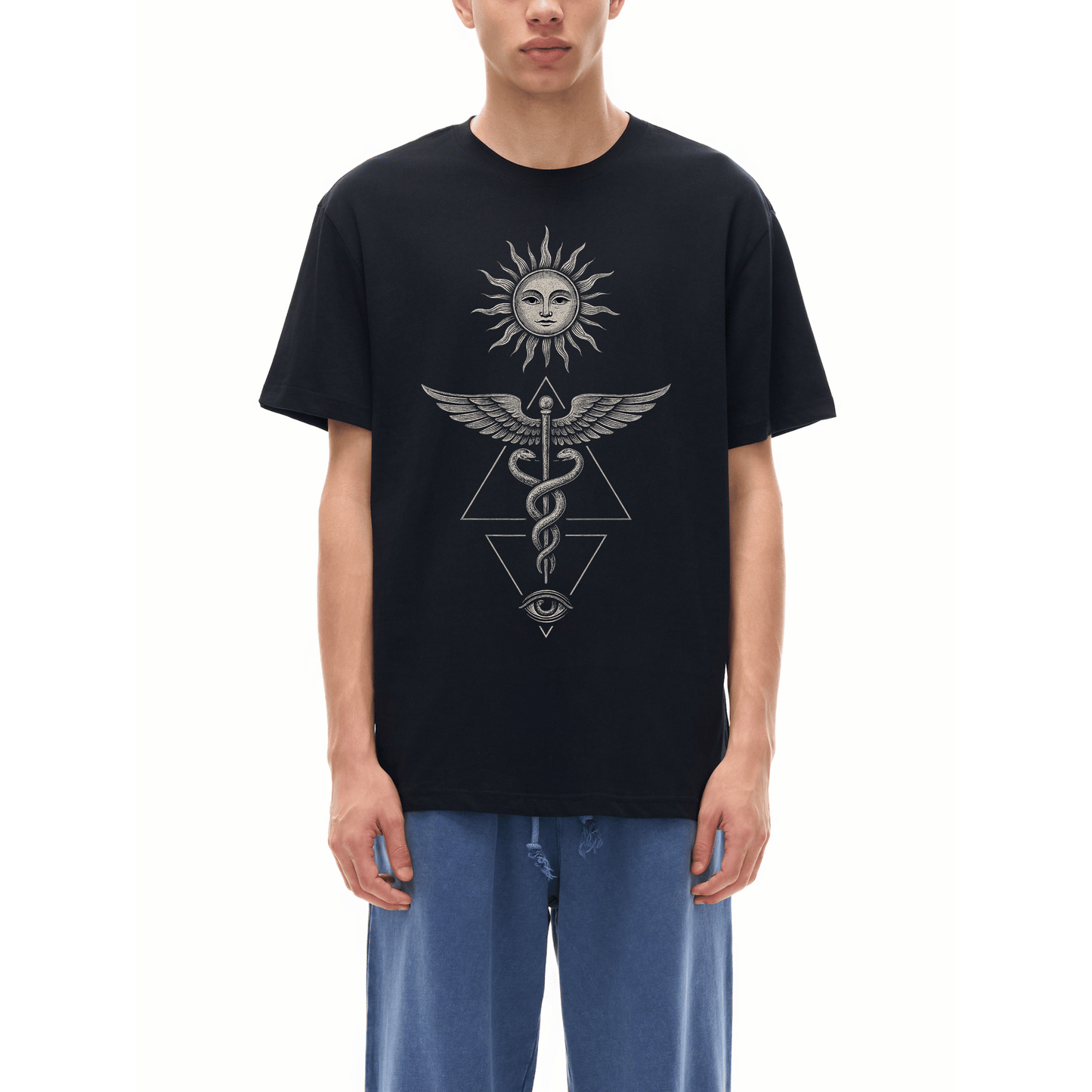 Model wearing black Inner Alchemy tee with sun face caduceus snakes and all-seeing eye graphic