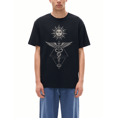 Model wearing black Inner Alchemy tee with sun face caduceus snakes and all-seeing eye graphic