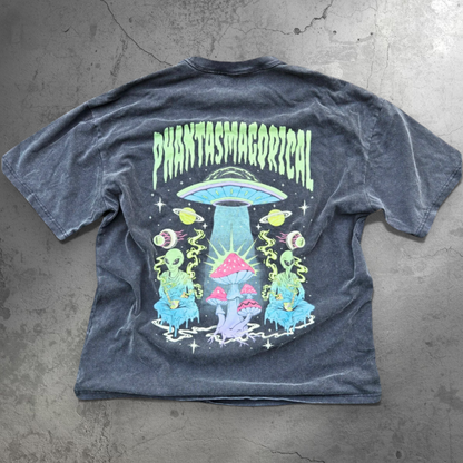 A black vintage heavyweight t-shirt with a graphic print in the center featuring a spaceship and various celestial bodies, with the word 'PHANTASMAGORICAL' above it.
