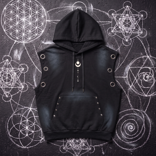Front of the Existential sleeveless hoodie in black vintage wash sun fade, laid on black asphalt covered in white chalk sacred geometry, showing the drawstring hood, three metal eyelets at each armhole, the riveted kangaroo pocket and the small white celestial stack down the chest.