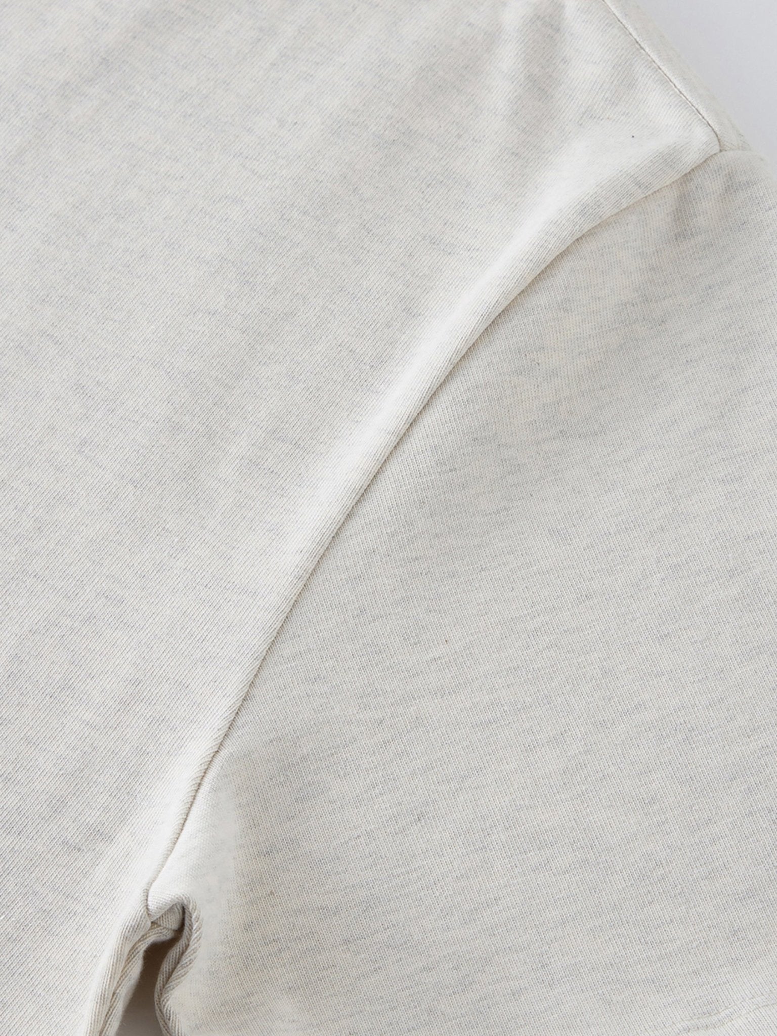 Dissolve The Ego oat gray 425 GSM tee underarm gusset and side seam stitching detail