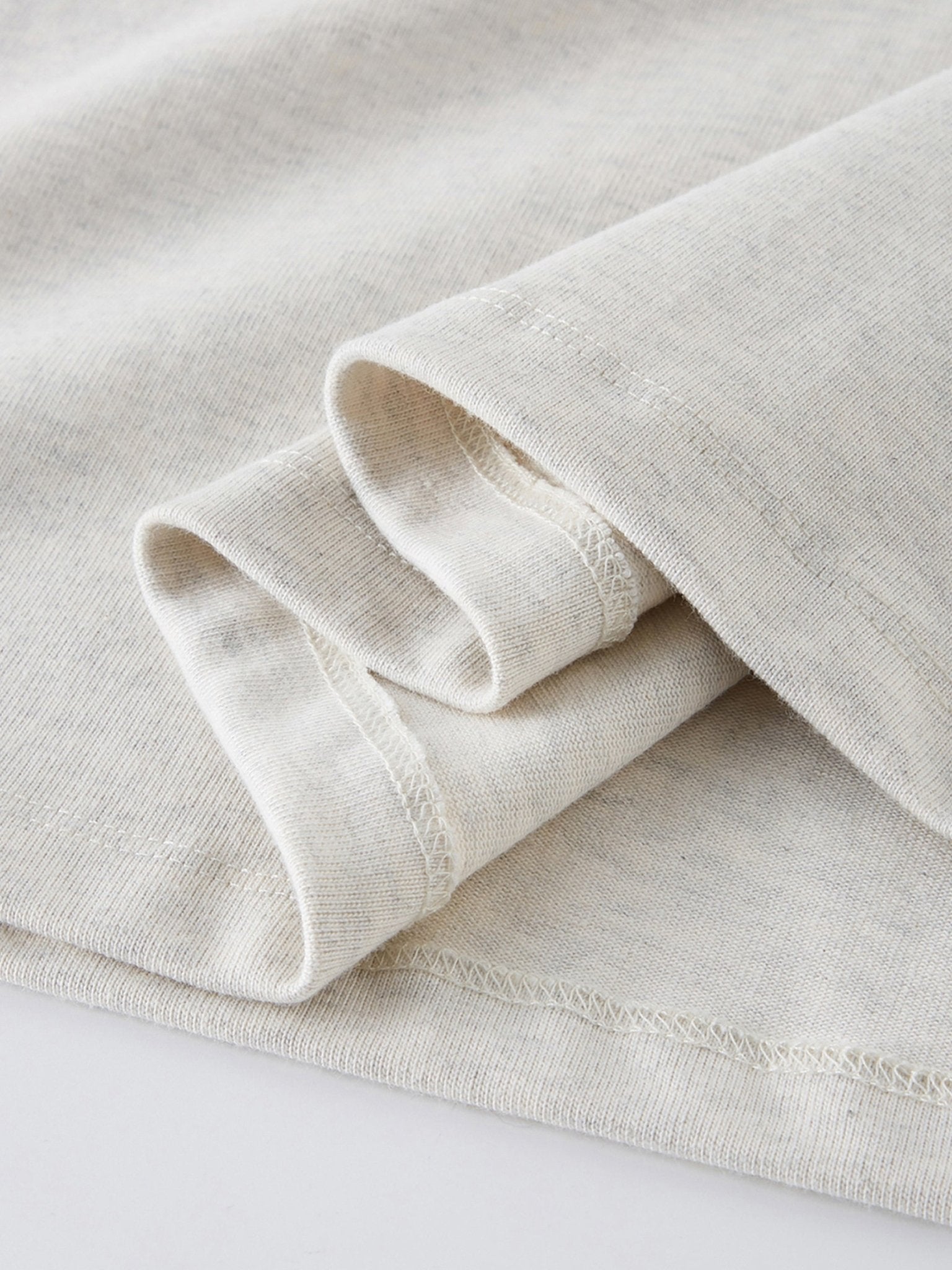 Dissolve The Ego oat gray 425 GSM tee rolled sleeve hem with coverstitch detail