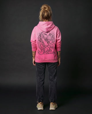Model wearing the Embrace The Chaos heavyweight sunfade relaxed fit hoodie in Pink, back view, showing the full back artwork.