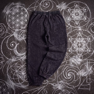 Back of the Existential Joggers in black, 420 GSM snow wash, plain back with gathered elastic waistband and ribbed cuffs, on chalk sacred geometry.