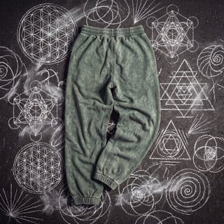 Back of the Existential Joggers in blackish green, 420 GSM snow wash, plain back with gathered elastic waistband and ribbed cuffs, on chalk sacred geometry.