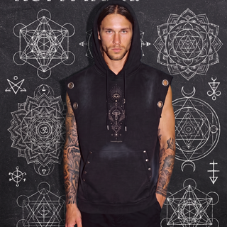 Model in the black Mystic Myco sun fade sleeveless hoodie, hood up with the kangaroo pocket and grommet-studded armholes, against a chalkboard wall of sacred geometry, captioned Not a hoodie. Not a tank.