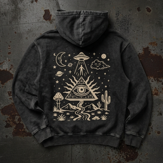 A dark gray washed hoodie shown from the back, featuring a large cream-colored cosmic and desert-themed graphic print with an eye in a pyramid, cactus, moon, and UFO, laid flat on a textured dark gray background.
