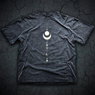Charcoal Existential fluffy vintage washed heavyweight tee laid flat on dark charcoal stone, printed in cream with a full-length celestial stack of a moon, crescent, stars and planets running down the chest.