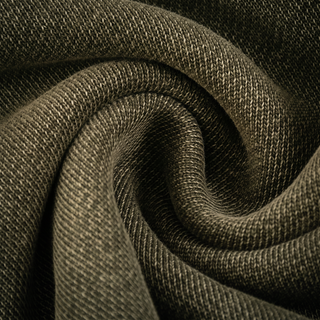 The Paradigm jogger fabric twisted into a swirl, showing the mottled mineral snow wash across the folds.