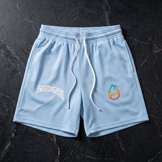 Sky Blue Nomenclature mesh drawstring shorts laid flat on dark stone, white Phantasmagorical wordmark on the left leg and pH flame logo on the right