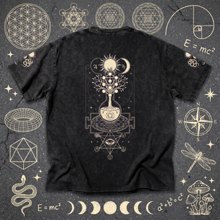 Black Celestial Synthesis snow wash oversized tee, back view, laid flat on chalk sacred geometry.