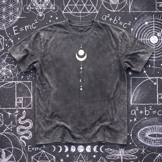 Front of the Existential snow wash oversized heavyweight tee in Pirate Gray, laid flat on dark asphalt covered in busy white chalk sacred geometry, with a small white crescent moon and star column printed at the center chest.