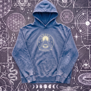 Royal blue Celestial Synthesis hand-frayed hoodie laid flat on chalk sacred geometry, front view.