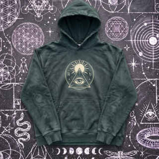 Blackish green Celestial Synthesis hand-frayed hoodie laid flat on chalk sacred geometry, front view.