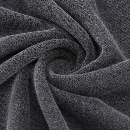 Charcoal gray soft cotton jersey fabric swirled to show smooth fluffy Yin Yang tee texture
