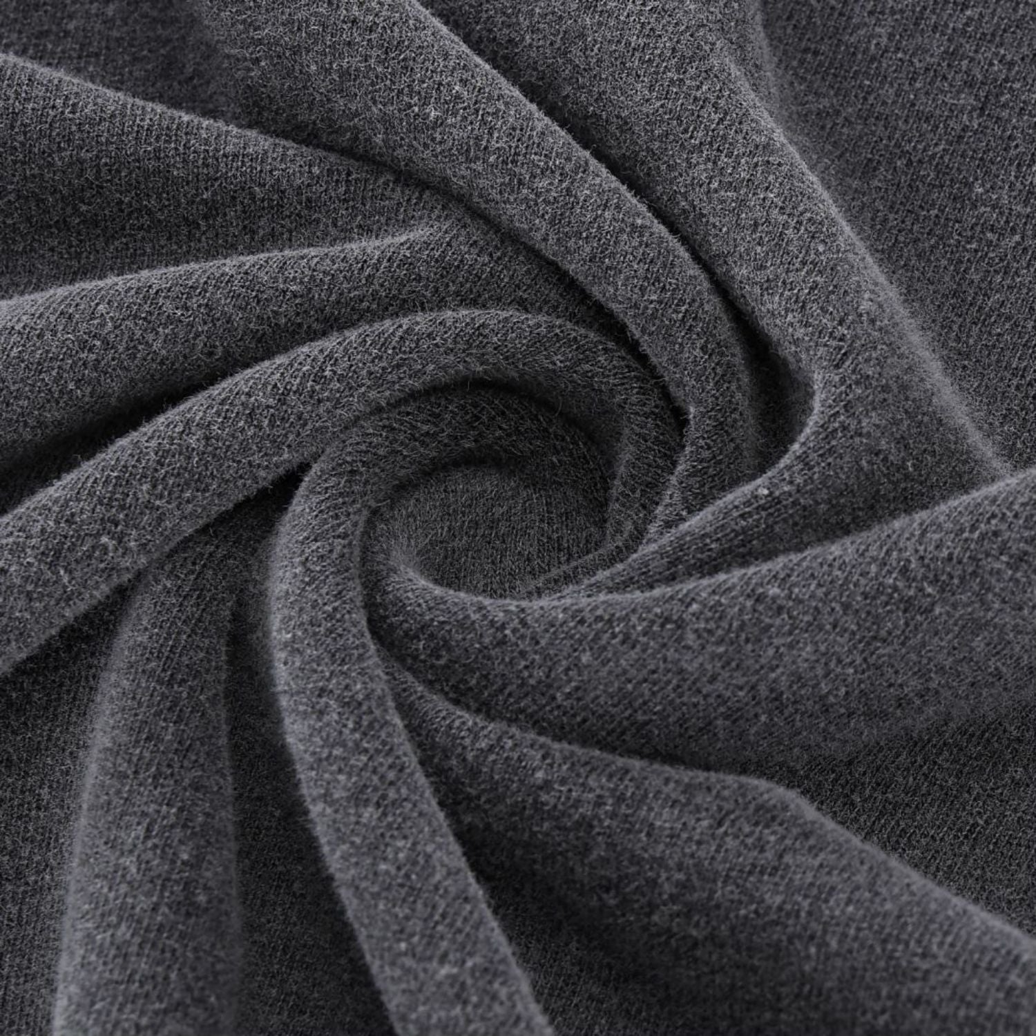 Close-up of Paradigm FV tee hem stitching on charcoal wash fabric