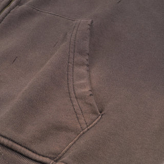 Cosmic Connection Zip Hoodie pocket detail close-up showing brown distressed fabric and stitching