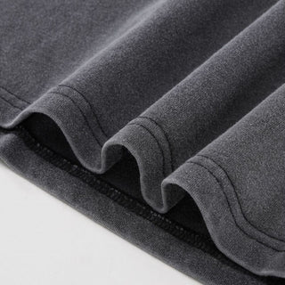 Layered hem detail showing double-needle stitching on Spectral Knight Fluffy Vintage tee