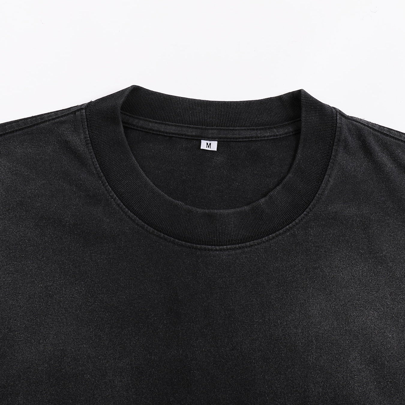Void Eclipse sunfaded tee crew neck detail showing ribbed collar on washed black heavyweight cotton