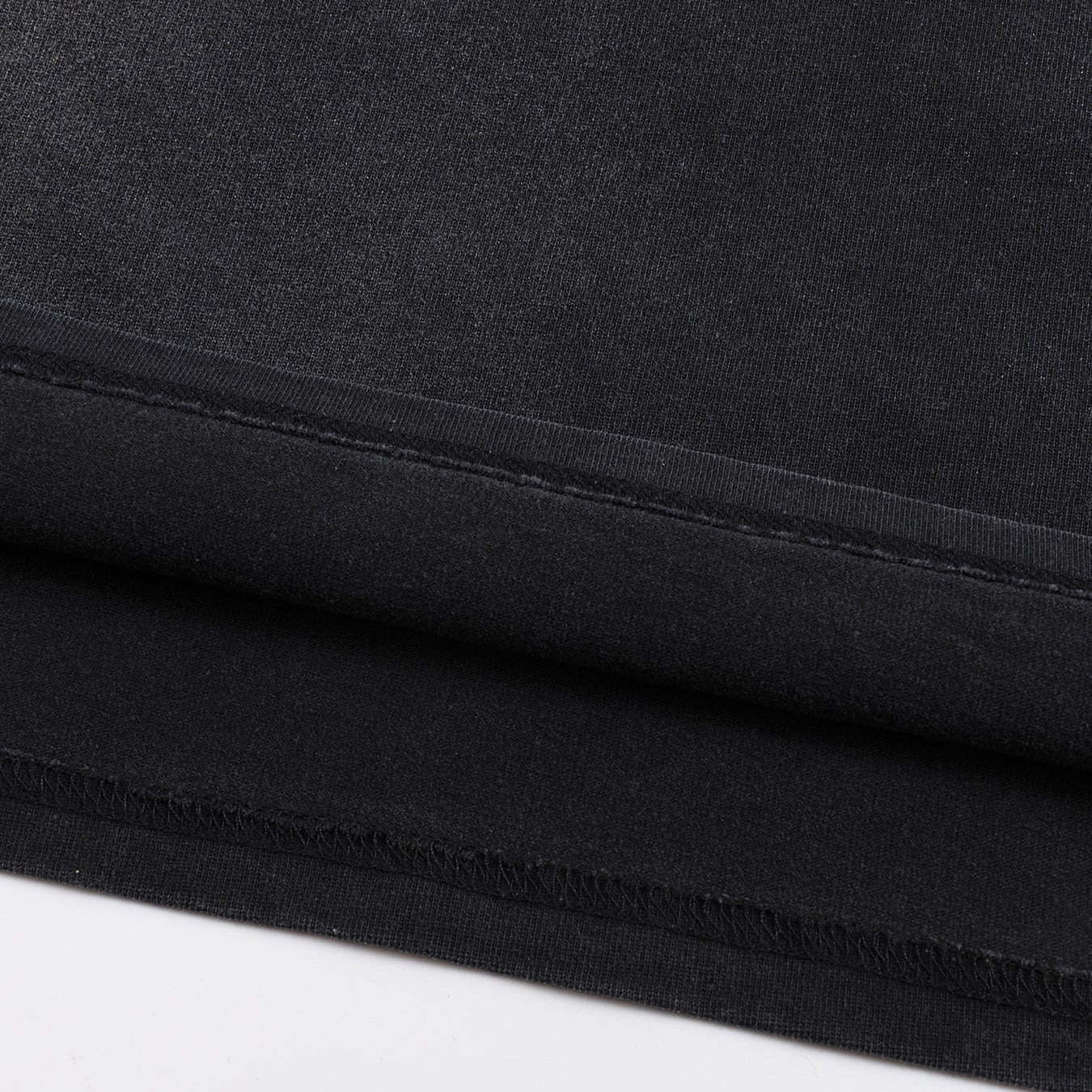 Void Eclipse heavyweight tee bottom hem double-stitch finish on sunfaded black cotton
