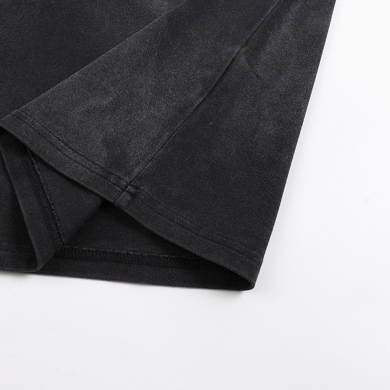 Void Eclipse tee layered hem with side split vent detail on 280 GSM washed black fabric