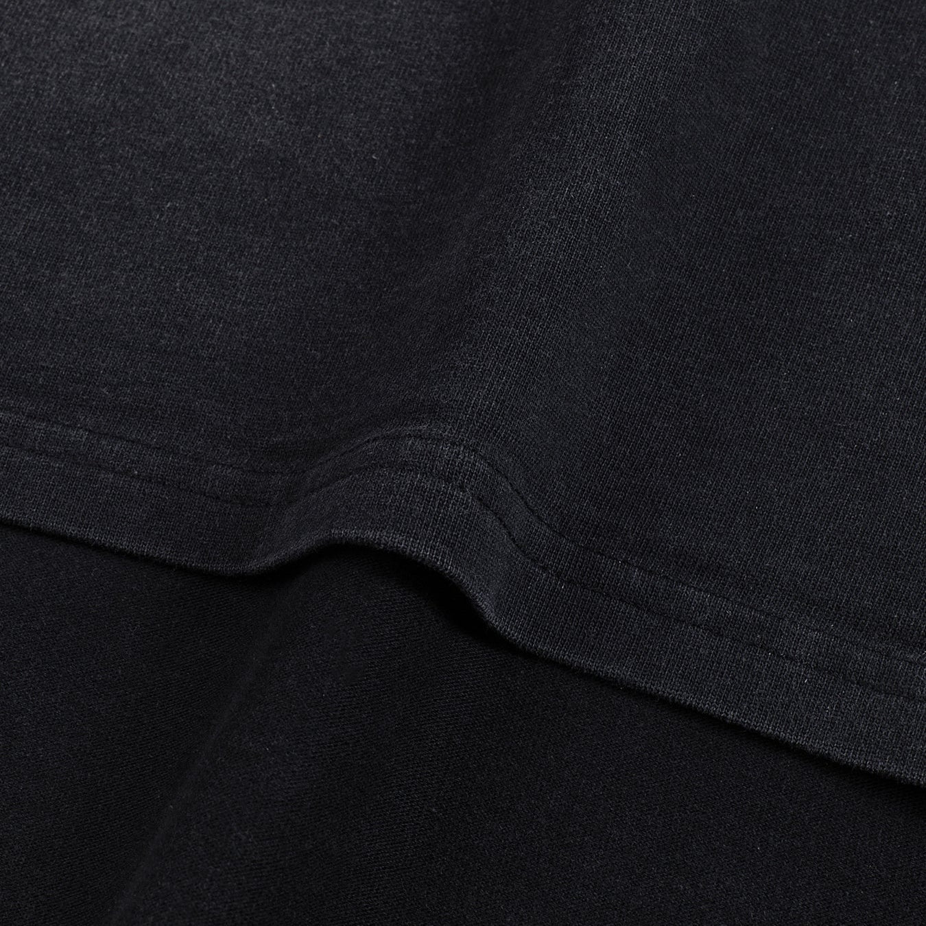 Void Eclipse sunfaded tee side seam and curved split hem detail on heavyweight cotton