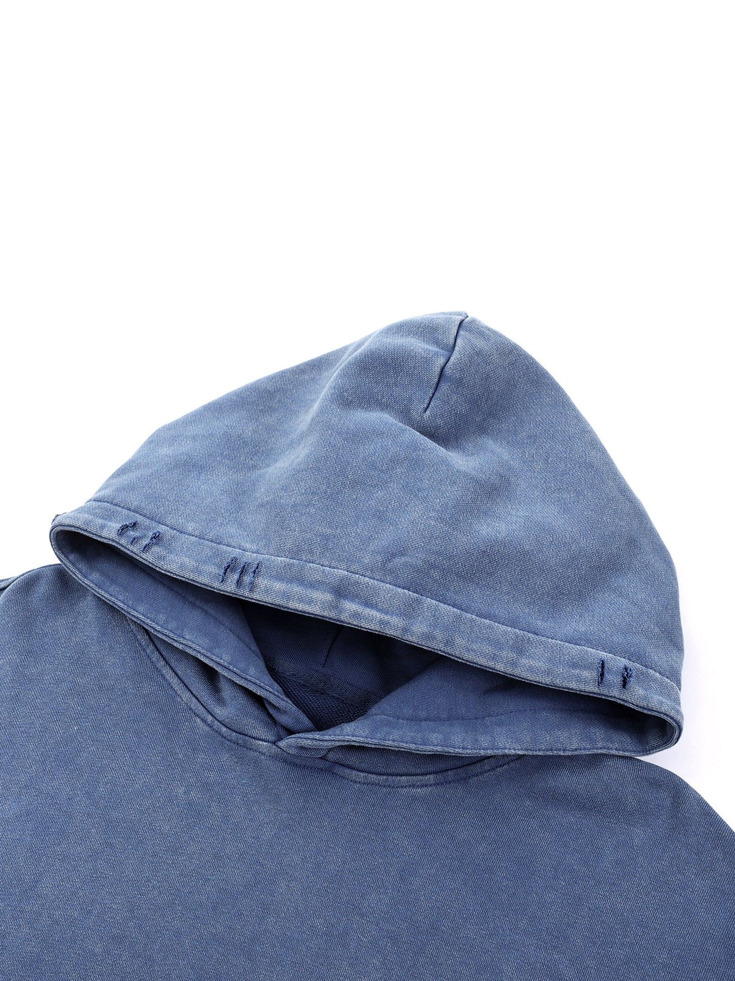 Close-up of blue Existential snow wash hoodie hood showing distressed detailing