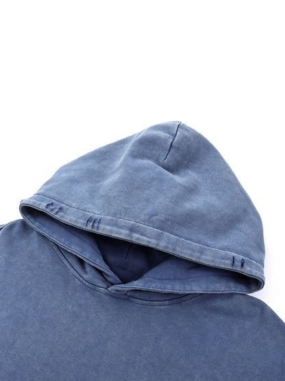 Close-up of blue Existential snow wash hoodie hood showing distressed detailing