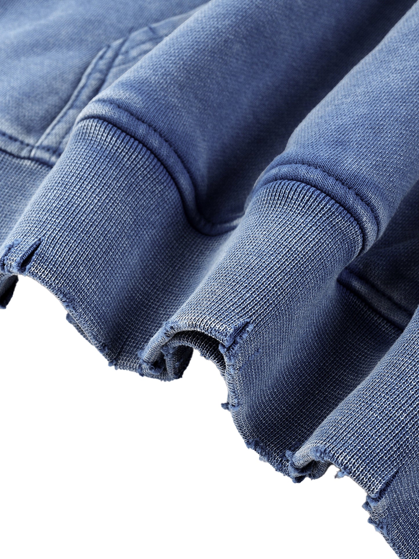 Close-up of blue Existential snow wash hoodie raw-cut hem with hand-frayed edges