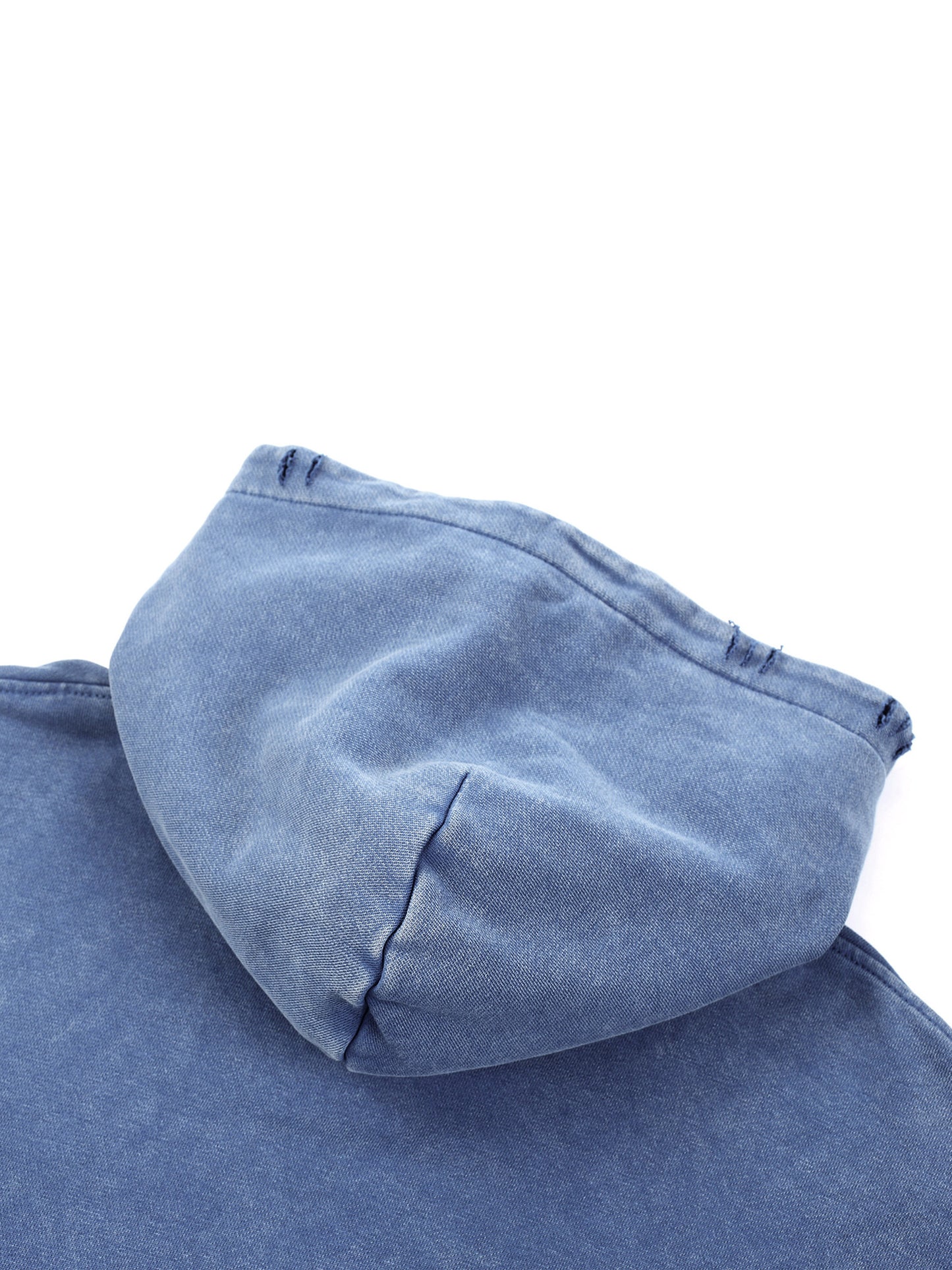 Close-up of blue Existential snow wash hoodie hood from side angle showing construction