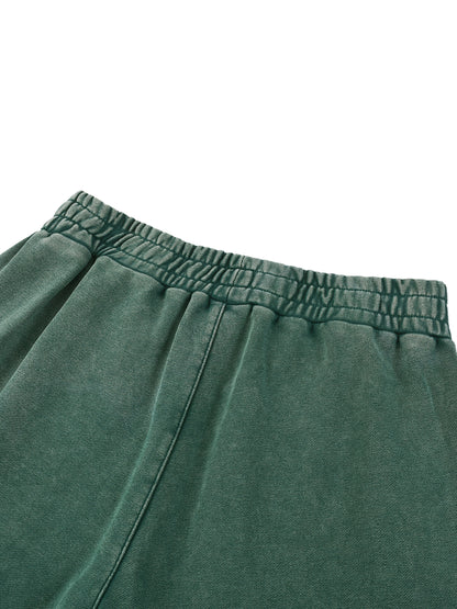 Paradigm snow wash jogger close-up of green elastic waistband stitching detail